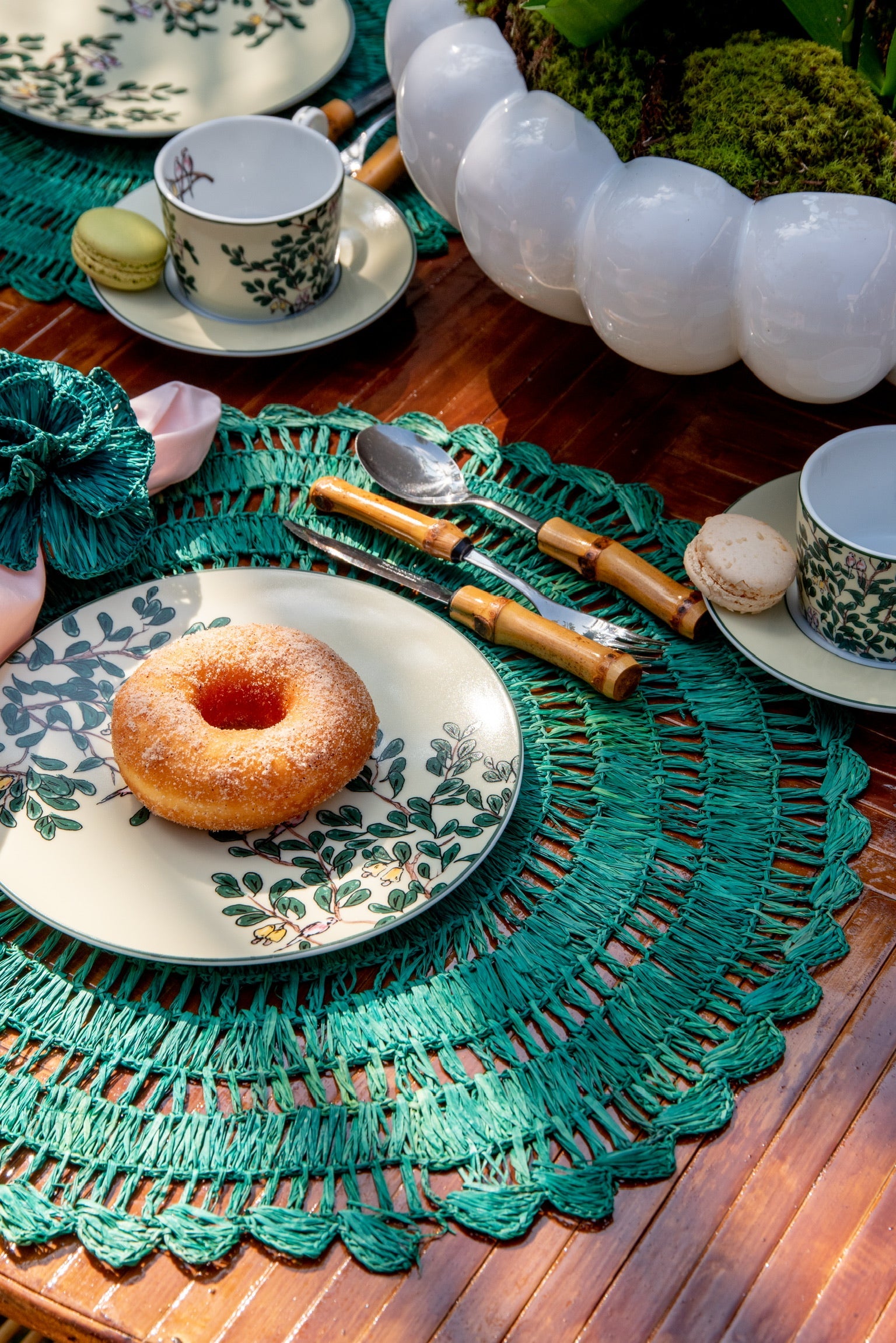 Buriti straw placemat handwoven from natural Brazilian palm fiber in green by Talah Home