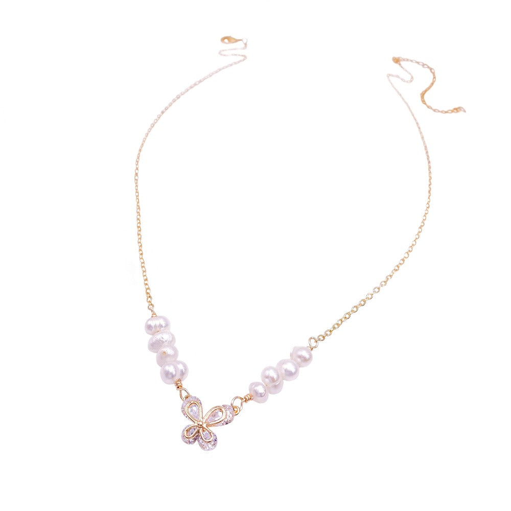 Gold pearl butterfly jewelry modeled