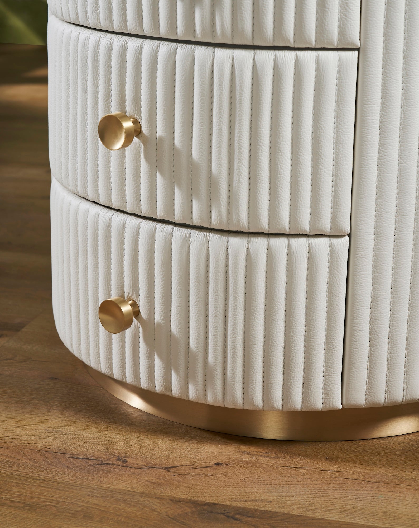 FN-5212-202022_5|Detail of white fluted leather nightstand with two drawers and gold metal base, premium leather furniture.