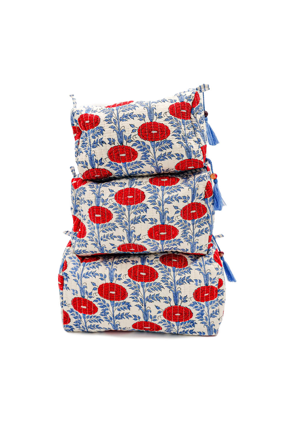 Stacked toiletry bags with red floral patterns from Inner Child