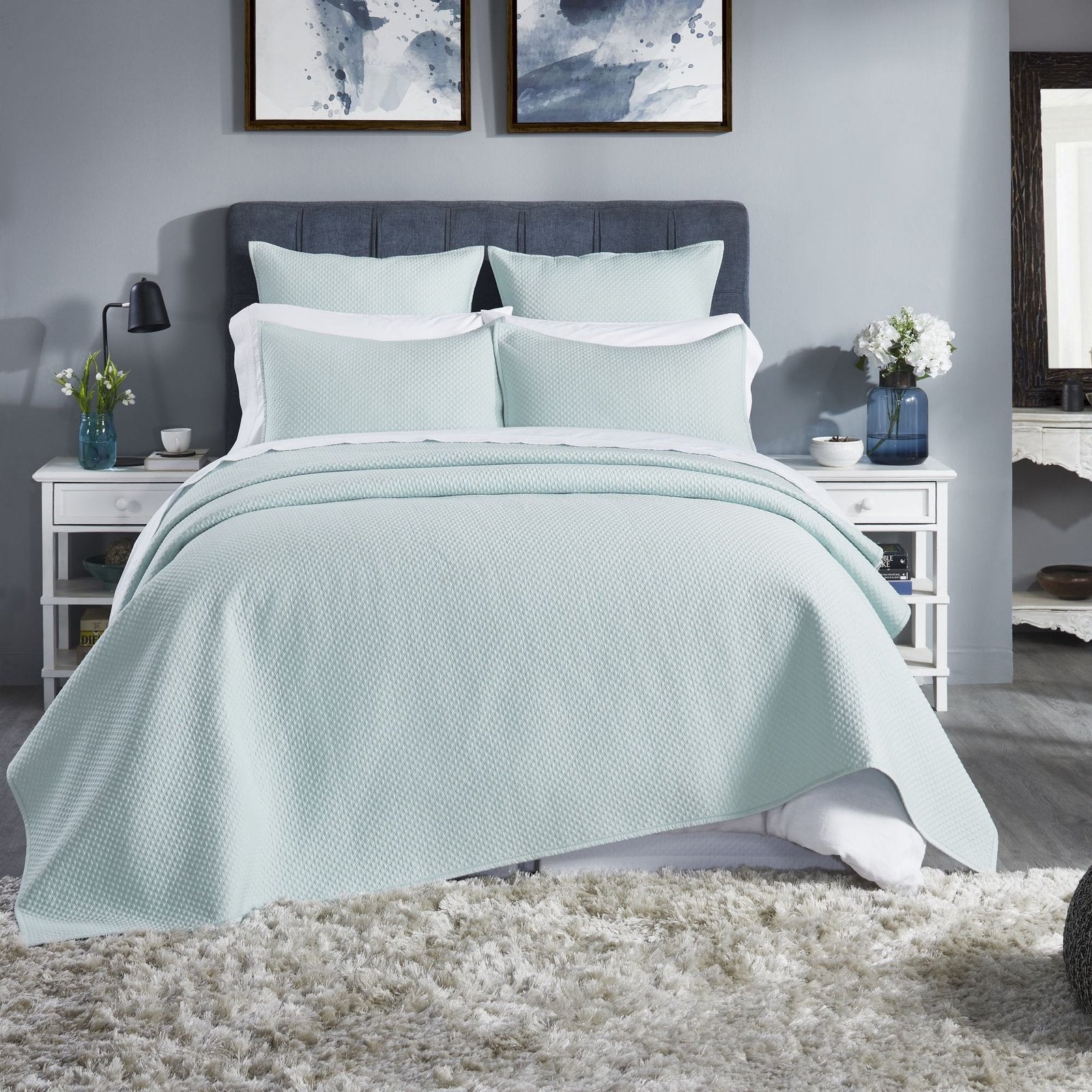 CL-252-11096_1|Refreshing mint green quilted coverlet adorning a stylish bed, offering cozy comfort and elegant modern bedroom appeal.