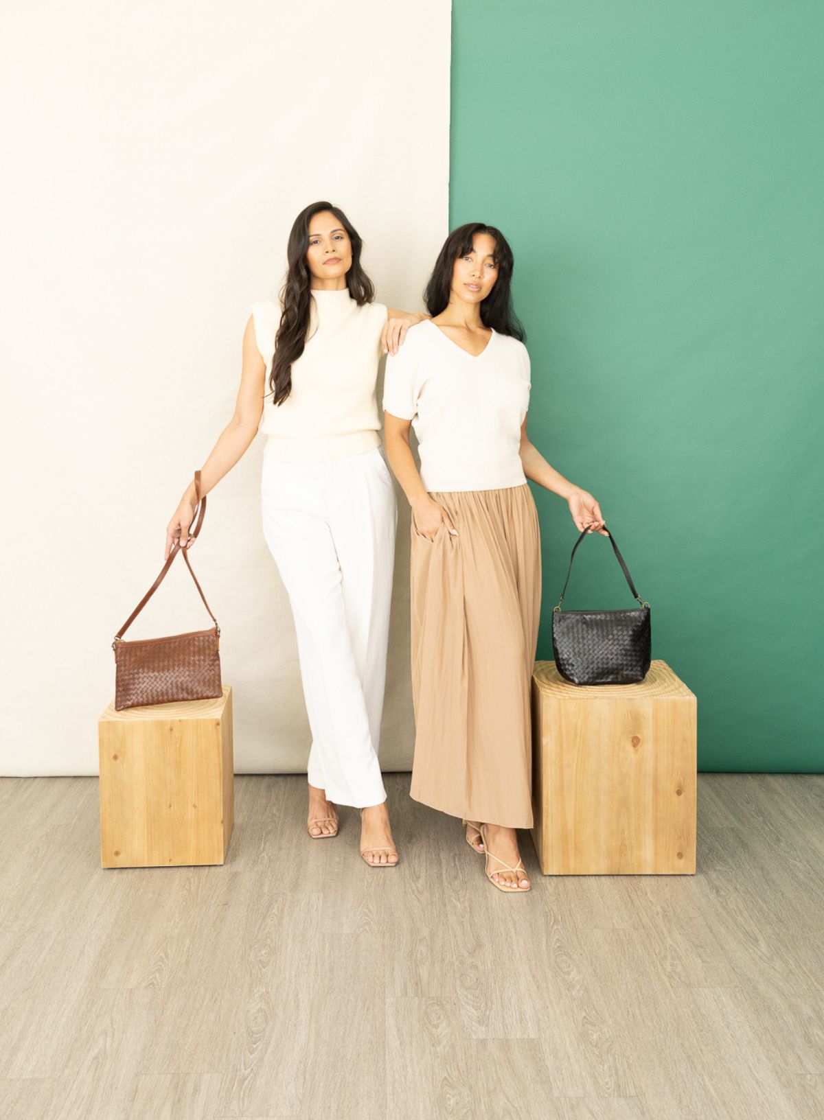 Women with black woven shoulder bags, fall/winter collection