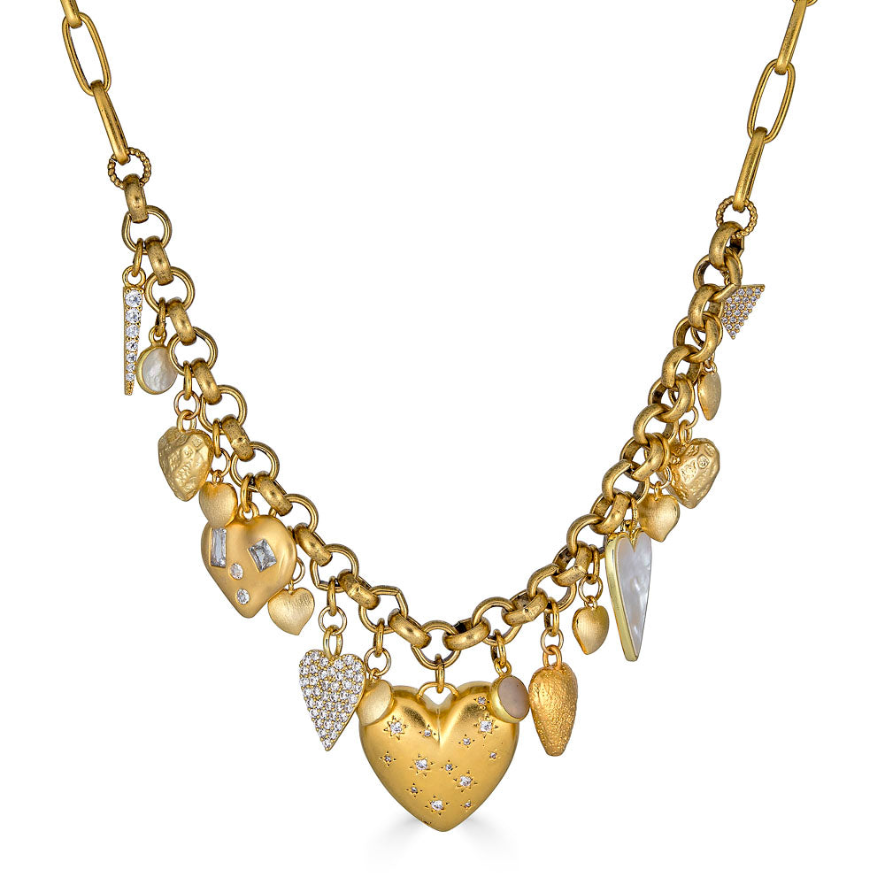 A close up of a Handmade gold heart necklace with oversized sculptural heart charm, styled for everyday wear.