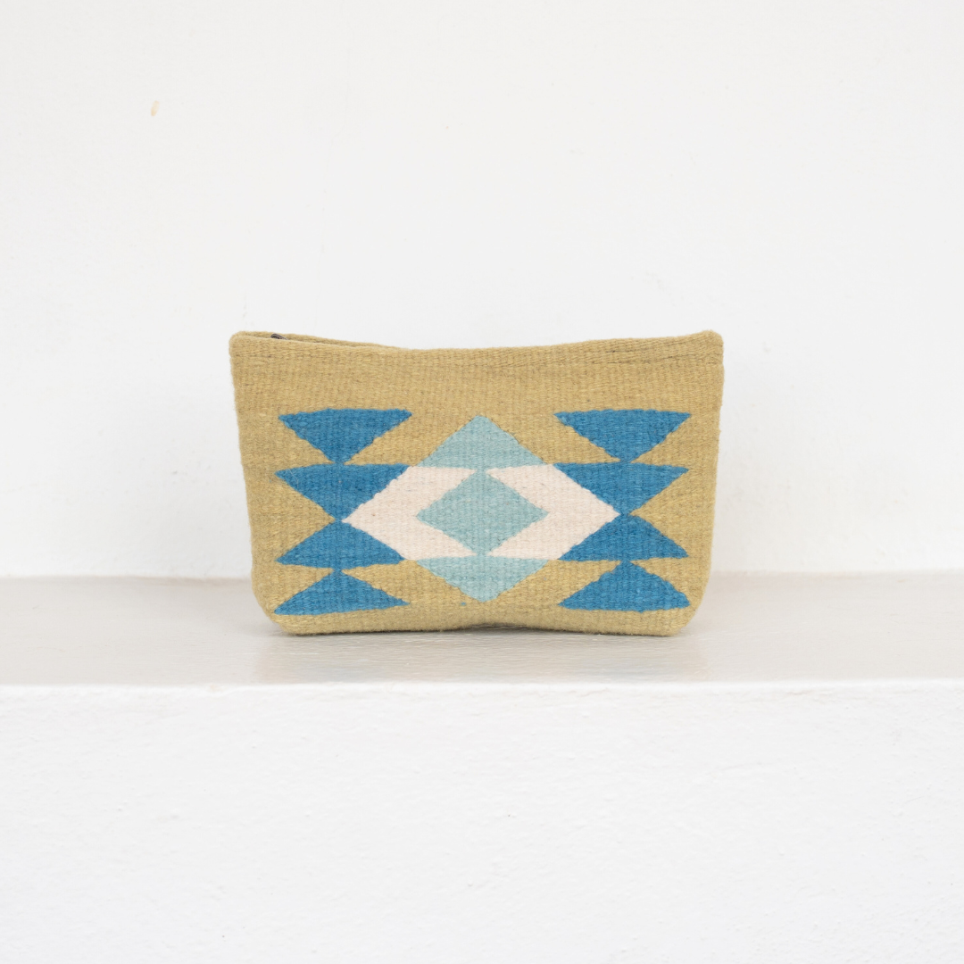 Handwoven pouch with abstract Zapotec butterfly design in bright spring colors, featuring internal pocket; perfect for makeup, wallet, or daily essentials.