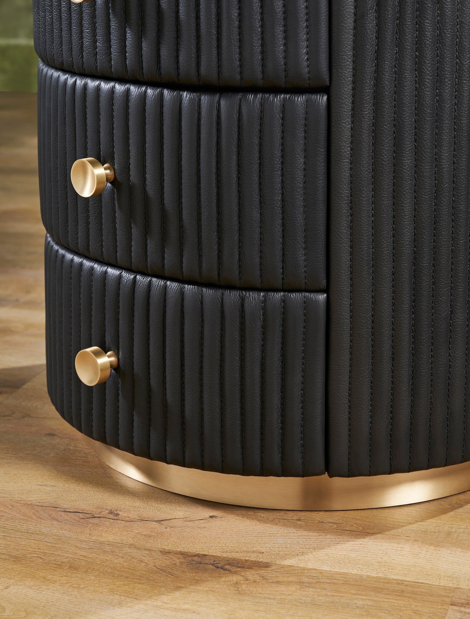 FN-5213-202022_5|Detail of black fluted leather nightstand with two drawers and gold metal base, premium leather furniture.