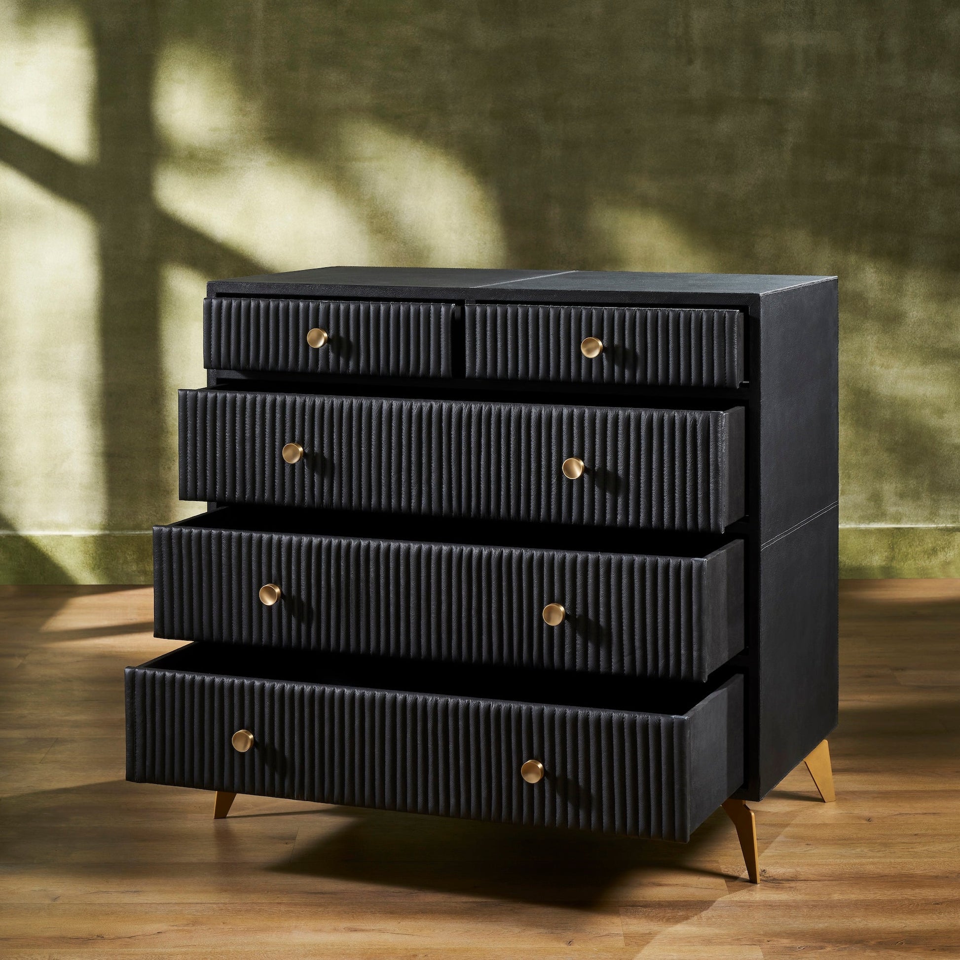 FN-5217-482036_3|Functional black ribbed leather dresser with multiple open drawers, revealing ample and stylish modern bedroom storage.