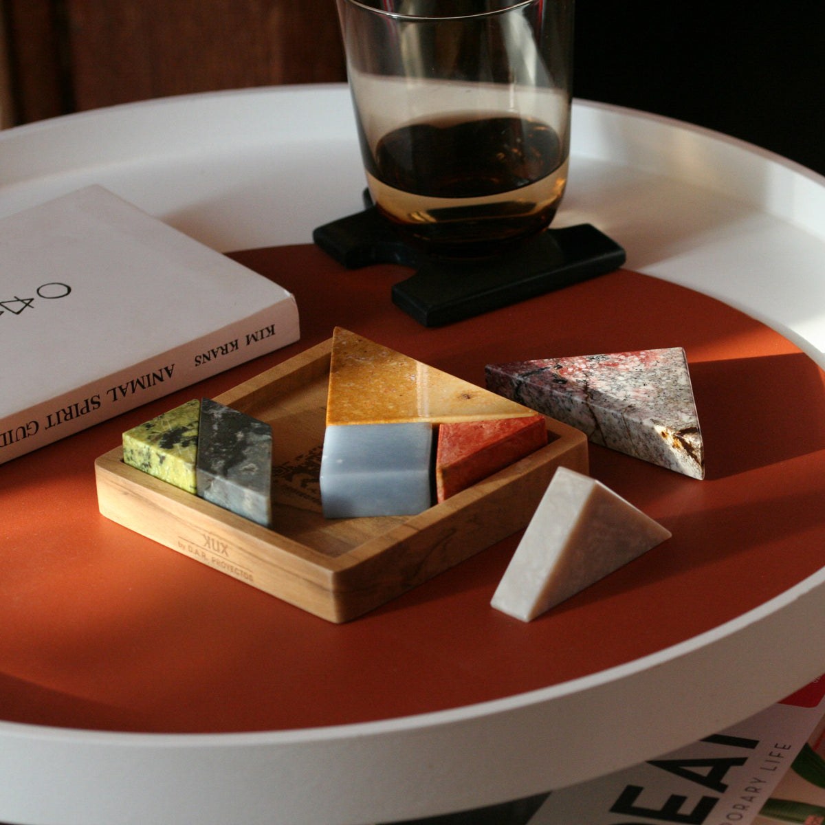Decorative Tangram puzzle bringing colorful Andean materiality to an elegant room setting.