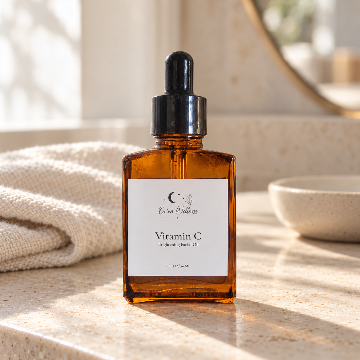 Orion Wellness Vitamin C Brightening Facial Oil on a light stone vanity with an ivory cloth in natural morning light