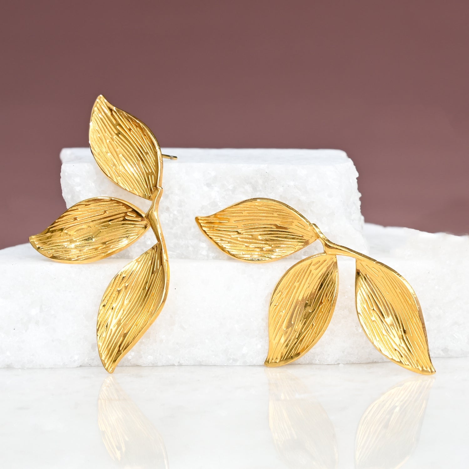 Gold leaf-shaped earrings, golden studs, jewelry shop, jewelry website, fair trade companies, women's jewelry
