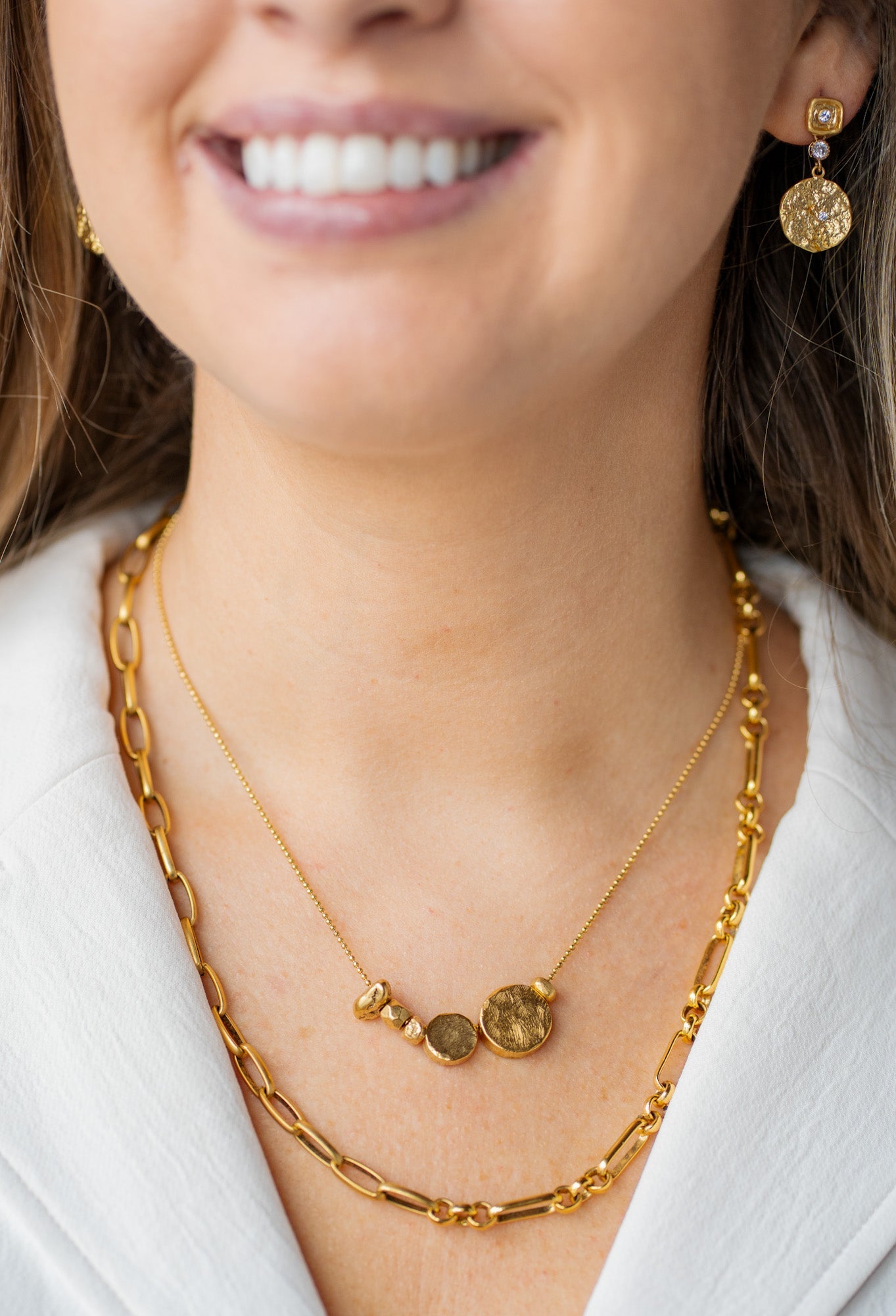 Gold necklace with asymmetrical round beads on a fine ball chain