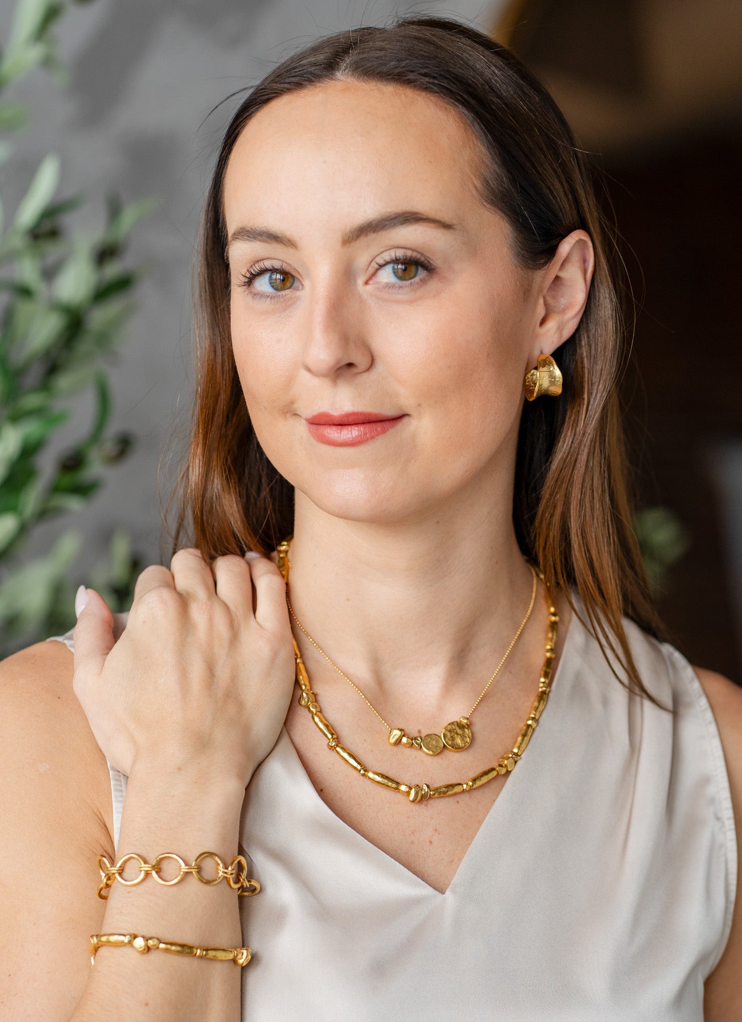 Gold necklace with asymmetrical round beads on a fine ball chain