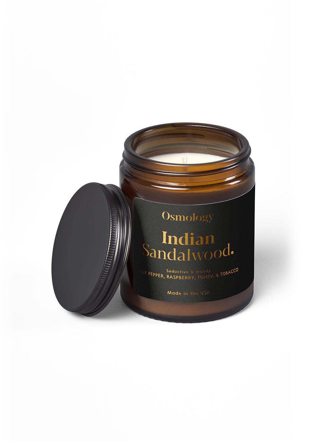 Osmology Indian Sandalwood jar candle with open lid on yellow cream background