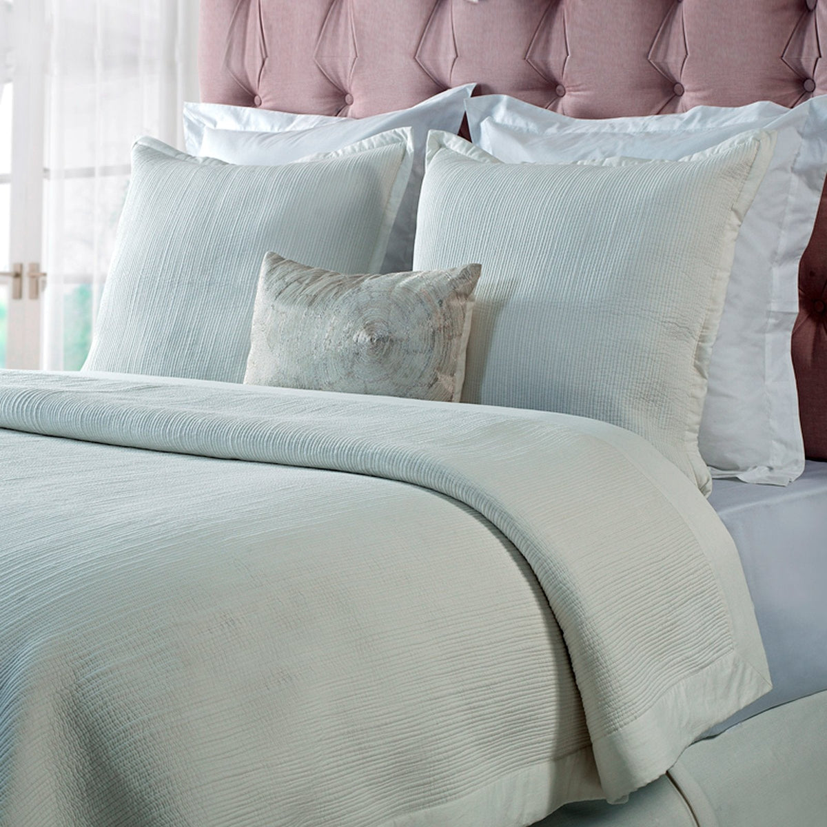 CL-158-9496_1|Elegant light cream textured coverlet providing a sophisticated and cozy layer on a bed, perfect for modern comfort.
