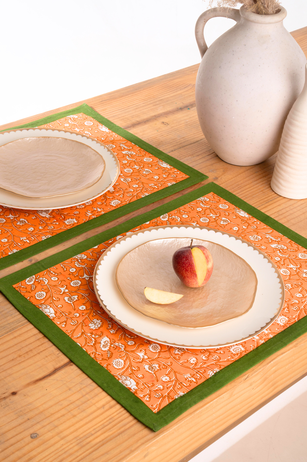 Orange blockprint placemats on wooden dining table from Inner Child