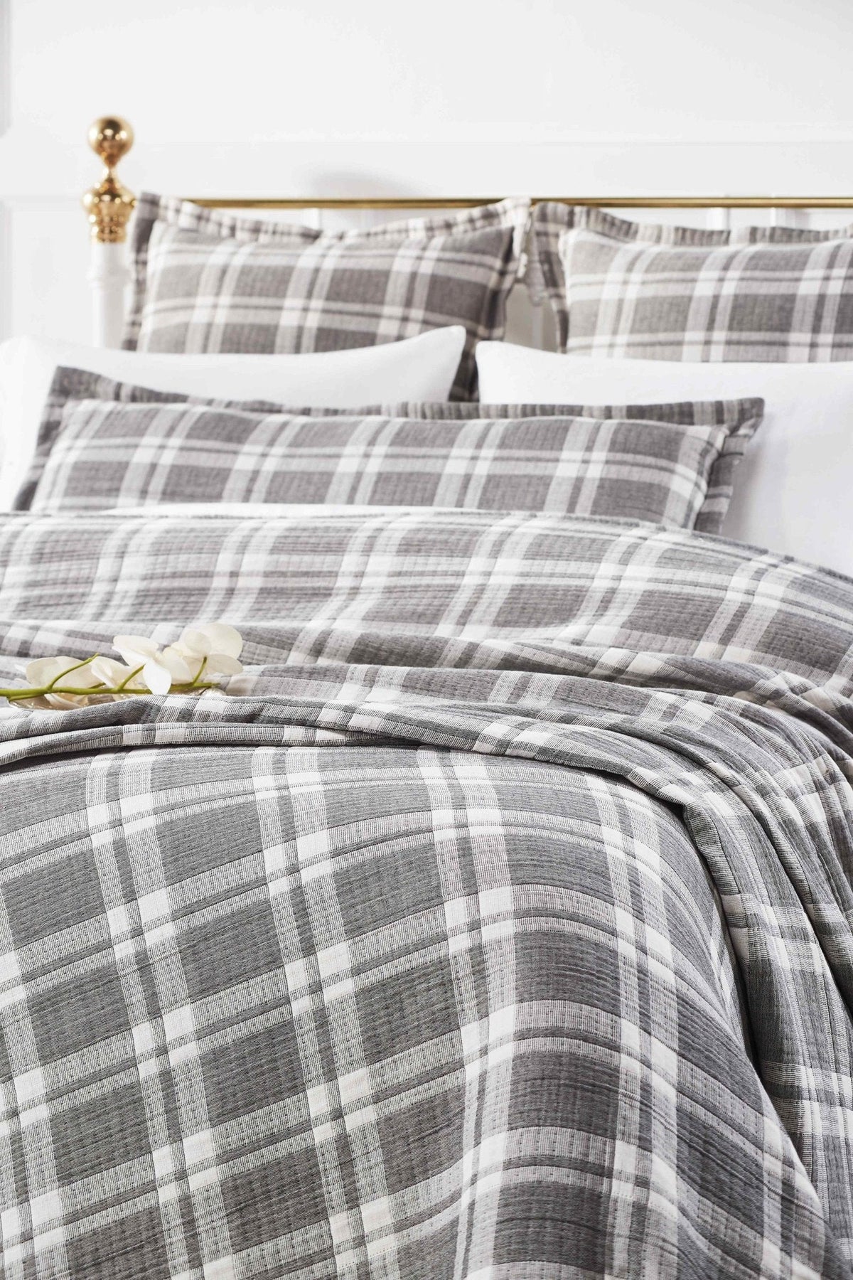 BT-116-11096_1|Cozy grey and white plaid blanket styled on a bed, adding a classic yet modern touch to bedroom decor.