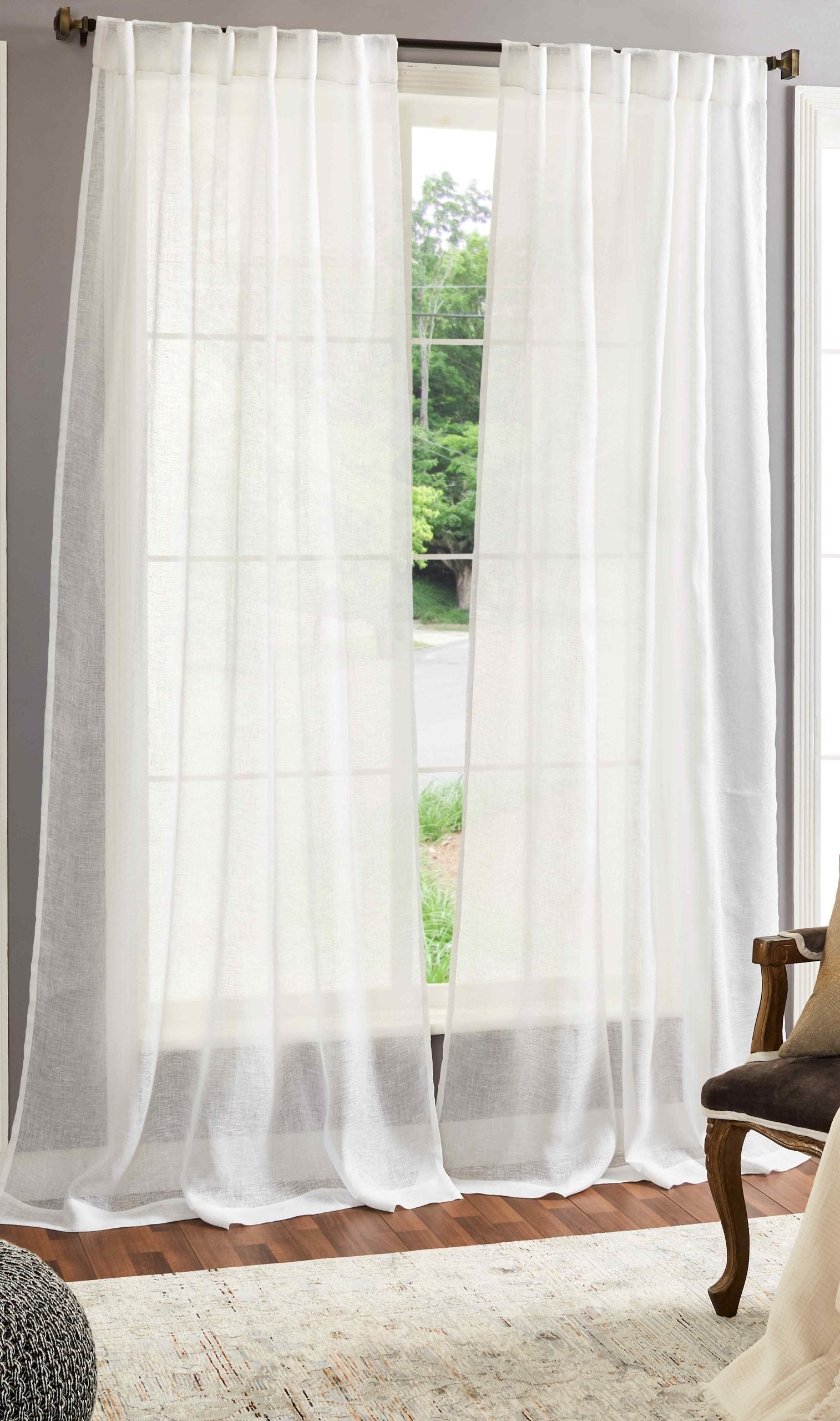 DY-710-5096_1|Flowing white sheer linen curtains hanging on a window, bringing natural light and airy elegance to a room.