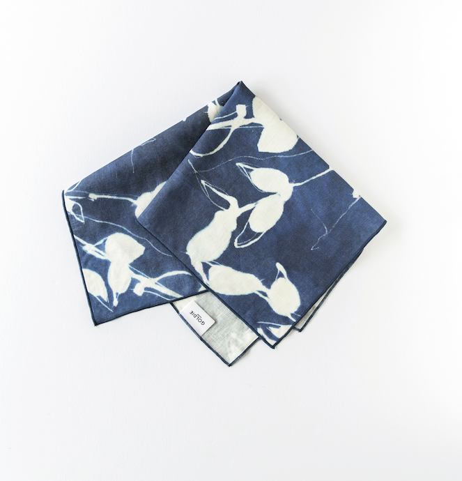 Porto Print Indigo linen dinner napkin styled on elegant place setting - Goldie Home
