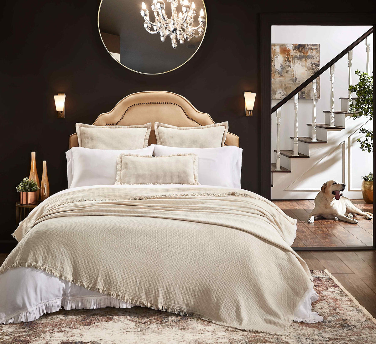 BT-111-X_1|Elegant, textured beige blanket with fringe detail covers a luxurious bed, enhancing bedroom comfort and style.