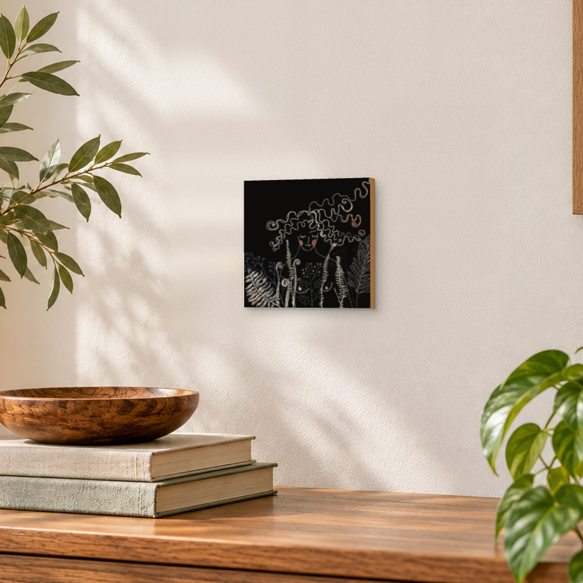 8×8 Wilderness Is Me art print on gesso board hanging on a wall in a styled room