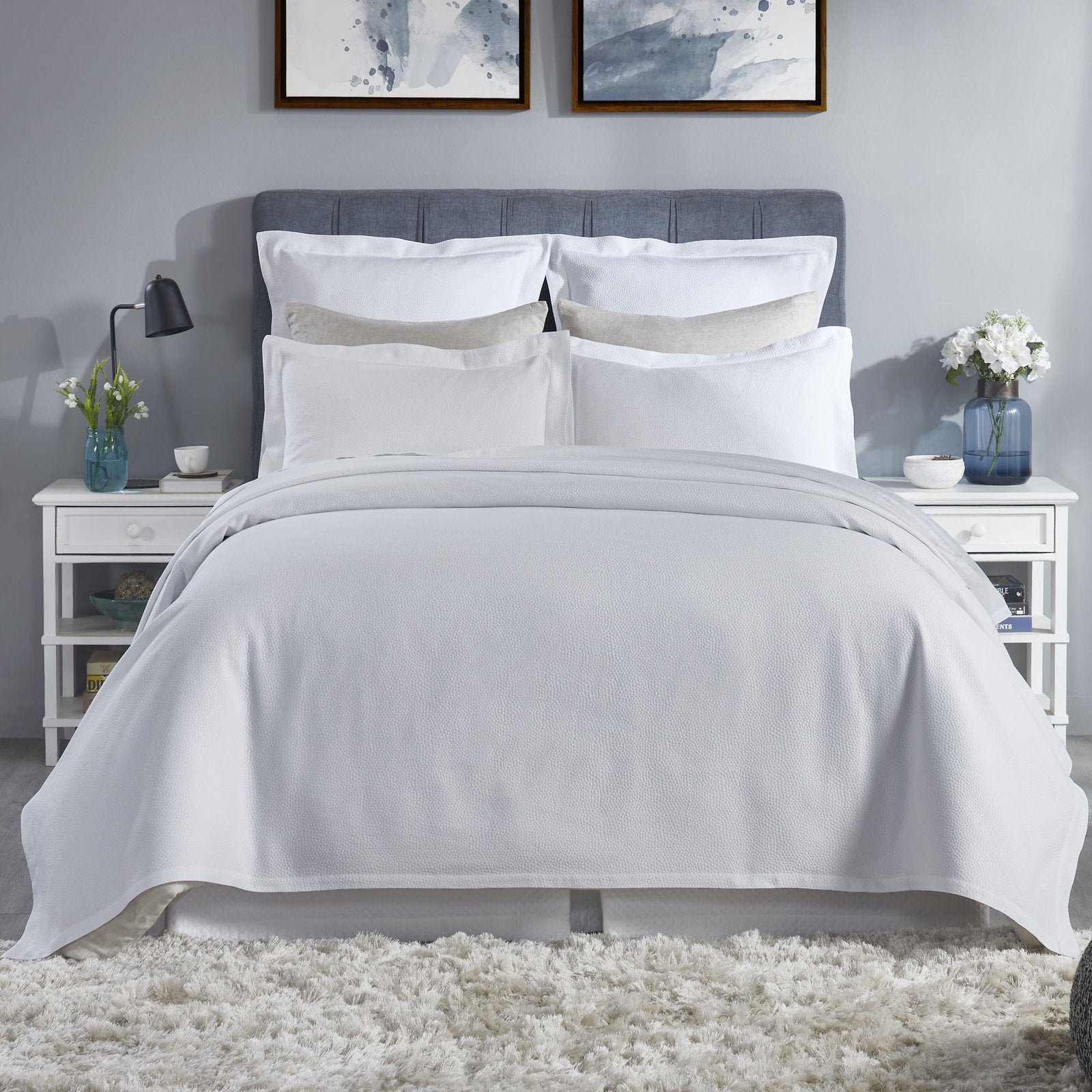 CL-258-9496_1|Crisp white coverlet featuring a delicate, subtle dimpled texture for a modern and clean bedroom design.