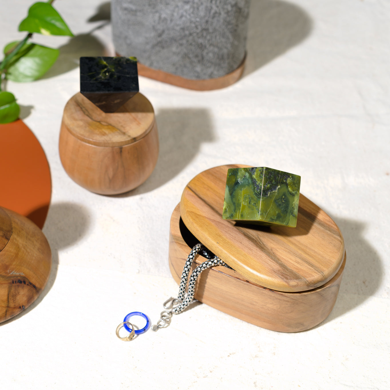Collection of decorative stone jewel boxes including the serpentine oval design emphasizing natural textures.