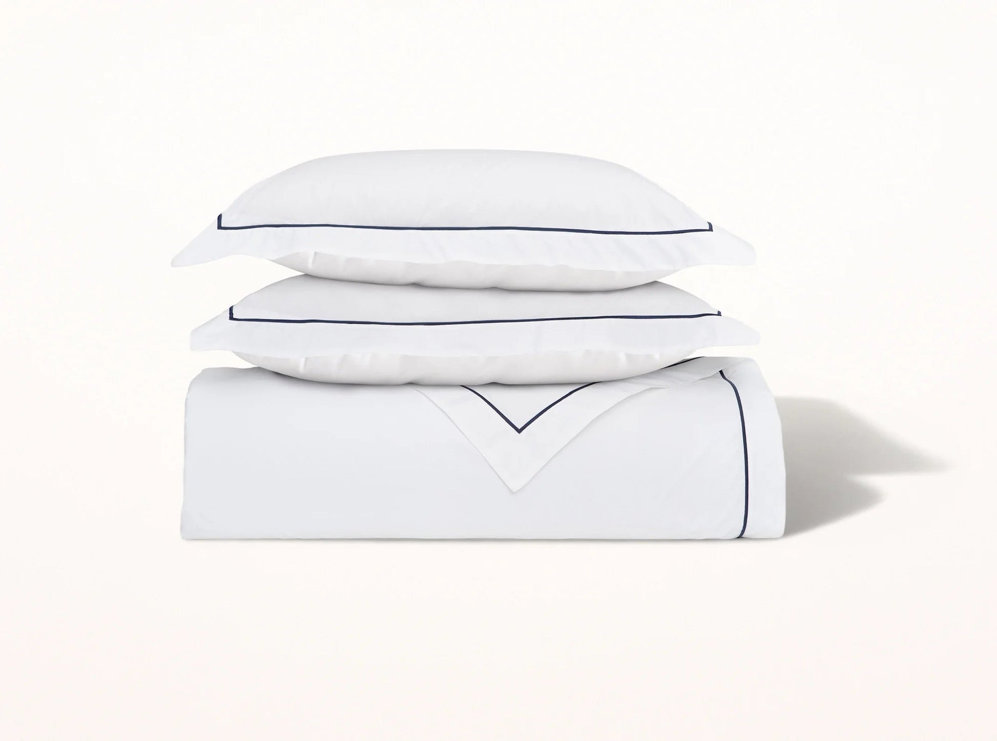Organic cotton percale duvet cover with navy blue embroidered detail on white