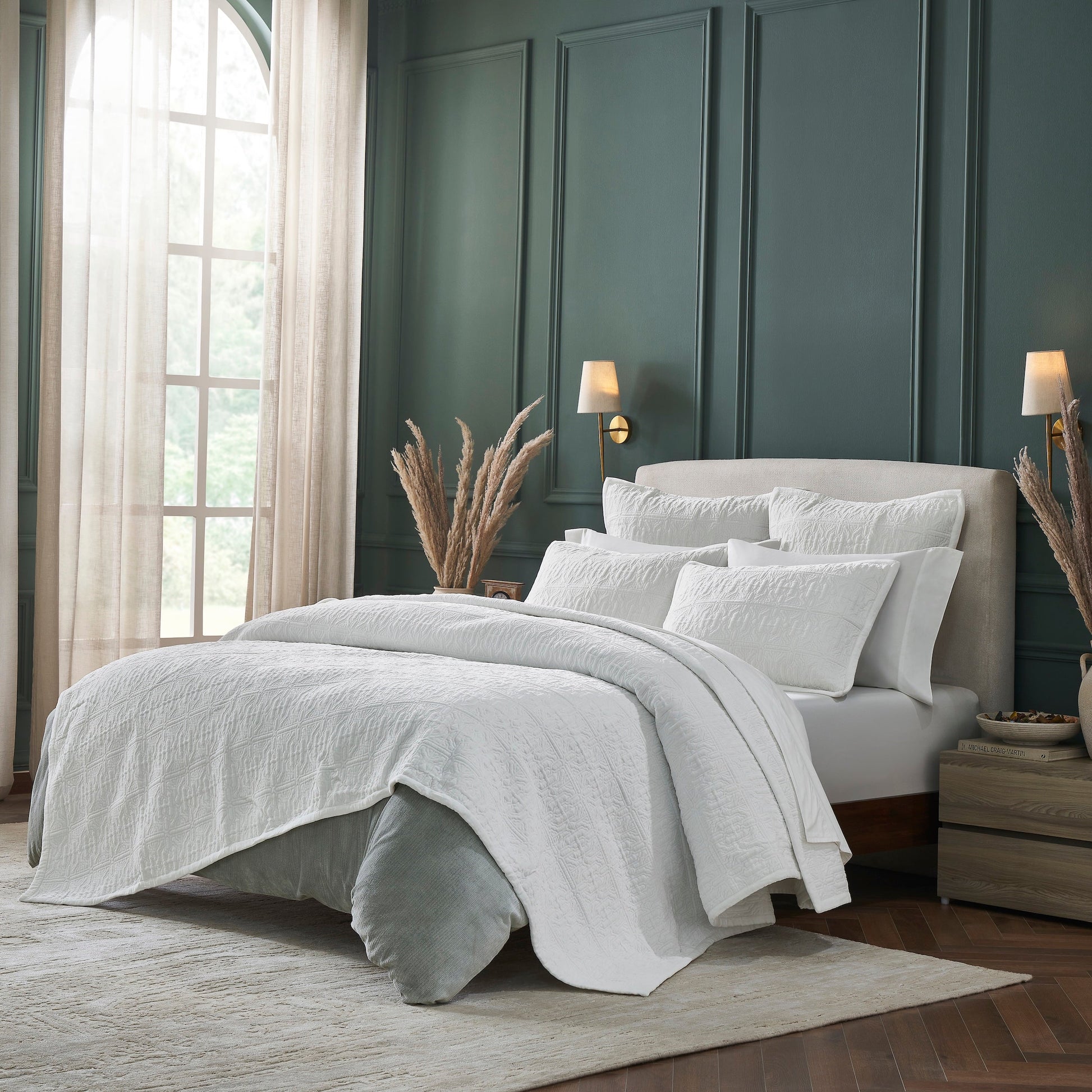 QT-376-9496_2|White quilted bedding set on a bed in a chic green bedroom. Soft textured quilt for elegant comfort and sophisticated style.