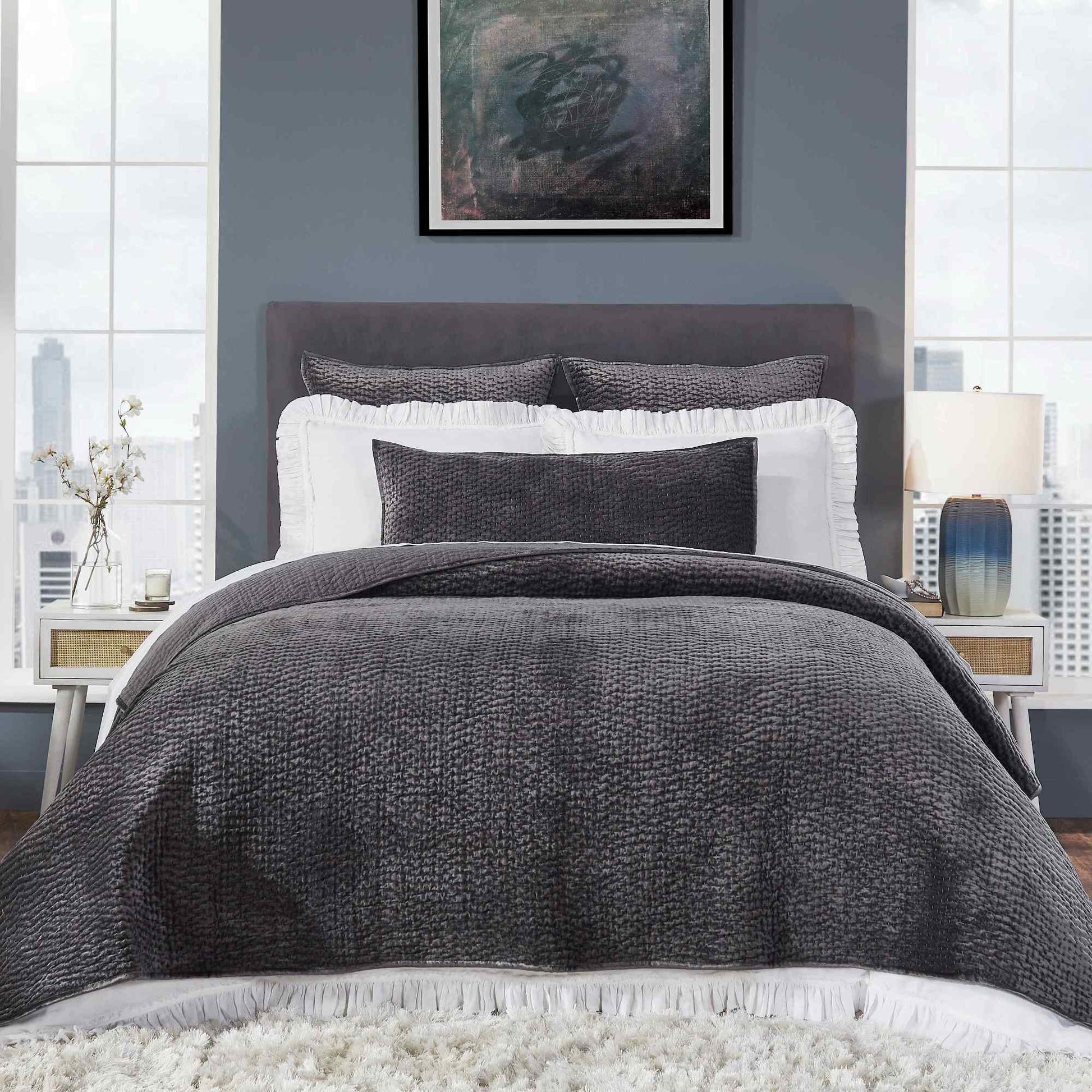 CL-184-9496-LOT1_1|Full view of a modern bedroom featuring a charcoal grey textured waffle weave coverlet set and white ruffled shams.