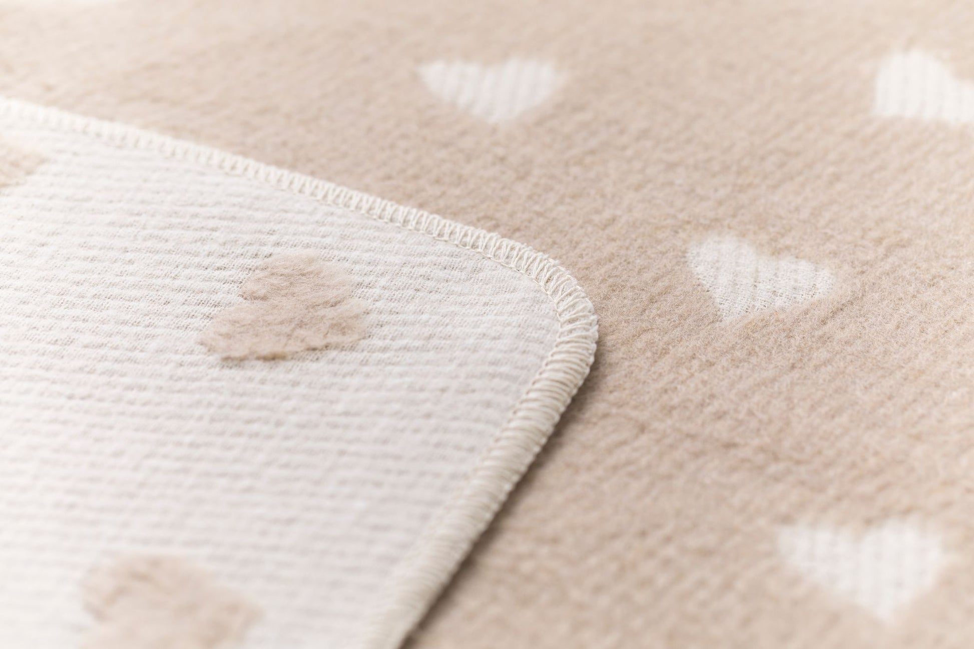 CARLA baby blanket "hearts allover" in offwhte grey . Blanket made by David Fussenegger , a family-run mill in Austria.