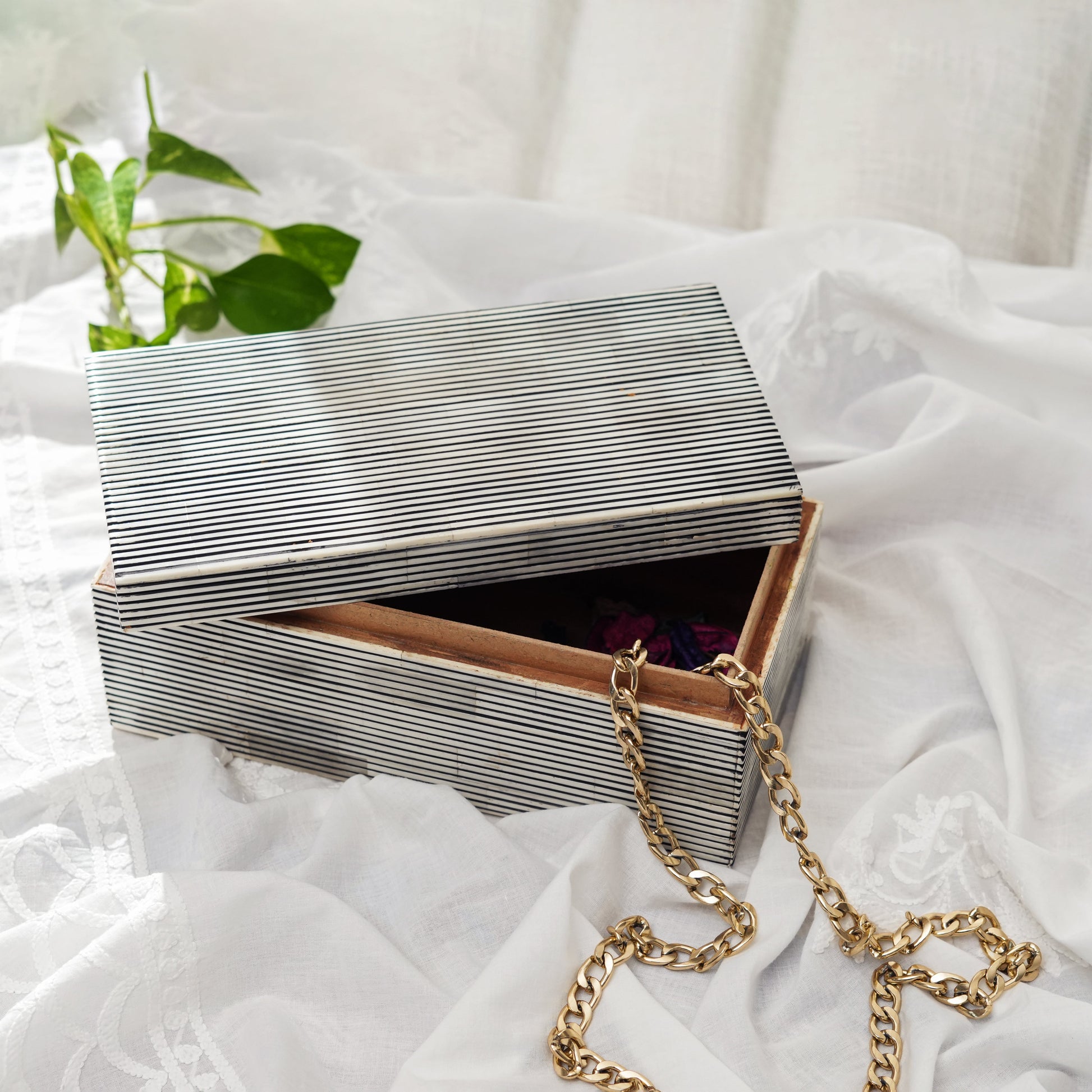 Decorative bone inlay box styled on a console or coffee table