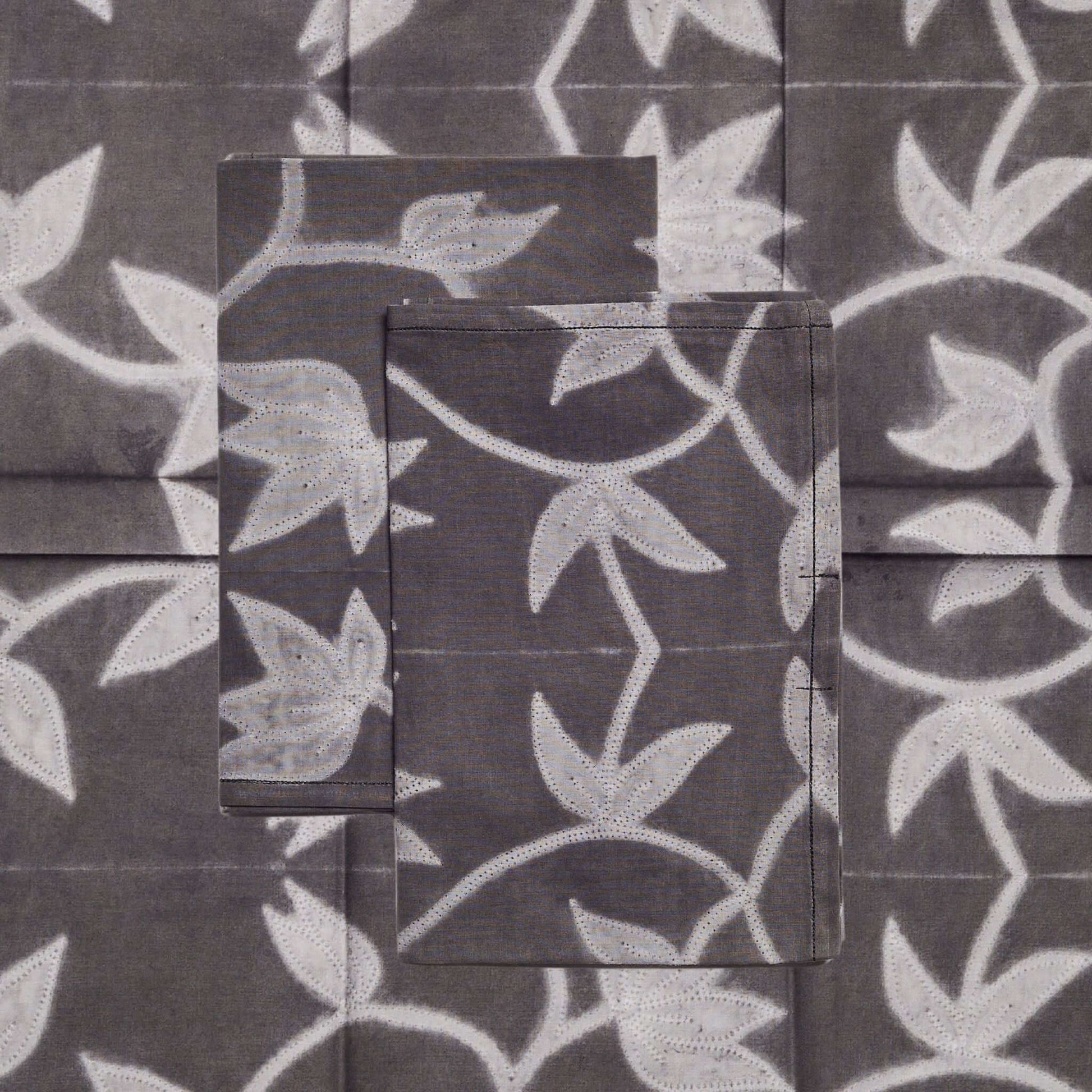 Folio Black Handcrafted Shibori Print Cotton Table Napkins ( set of 4 ) featuring unique white floral designs on dark fabric.