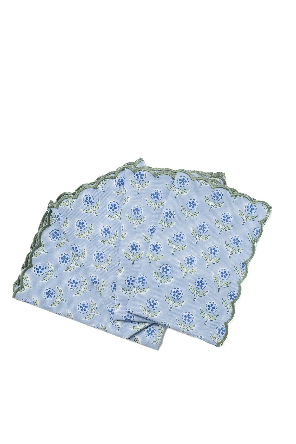 Set of four blue scallop-edged napkins with blockprint flower pattern