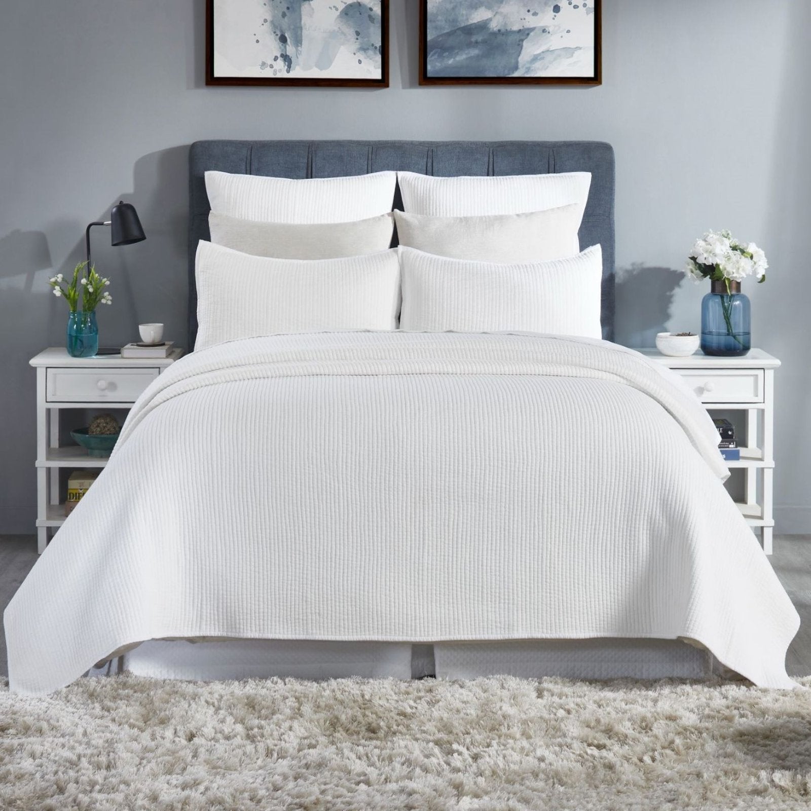CL-196-9496_4|Stylish white channel stitch quilted coverlet adorning a modern bed, creating a serene and inviting bedroom ambiance.