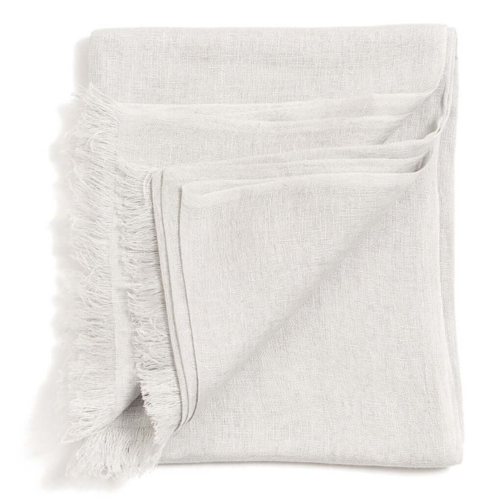 Soya Pastel Lime Green Hand Woven Soft Linen Scarf displayed folded with soft texture and fringed edges.