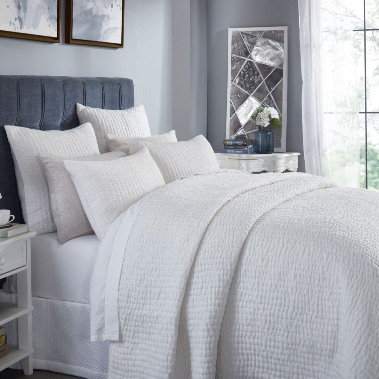 QT-359-9496_3|Detailed view of a soft white textured quilt, showcasing its cozy, breathable fabric and inviting bedroom comfort.