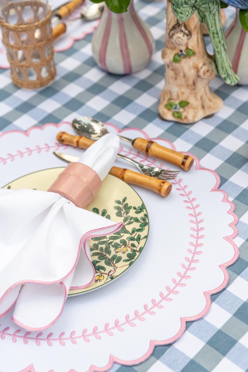 Arrow impermeable placemat with geometric border design in pink by Talah Home