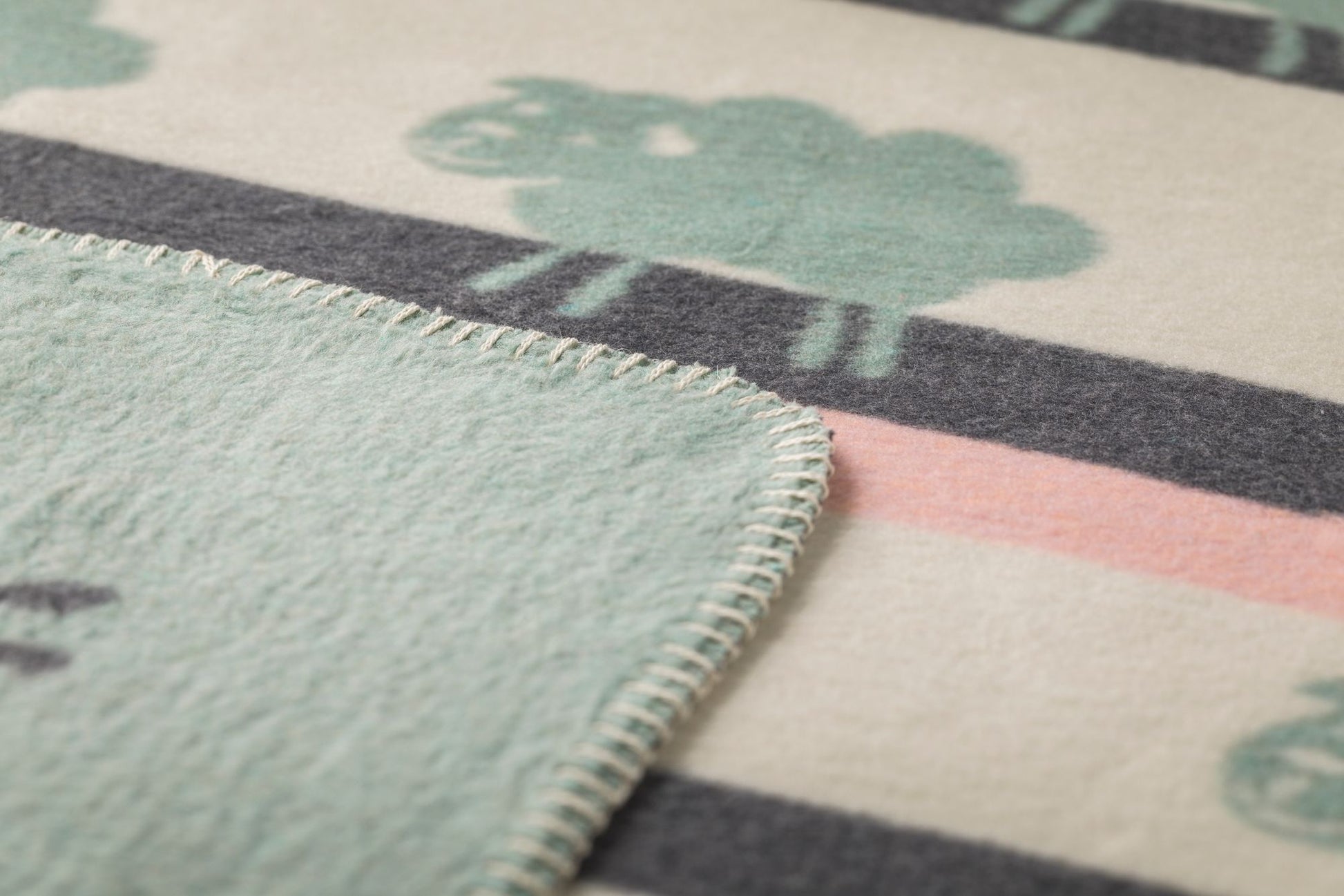 MILA baby blanket "sheep allover" in . Blanket made by David Fussenegger , a family-run mill in Austria.