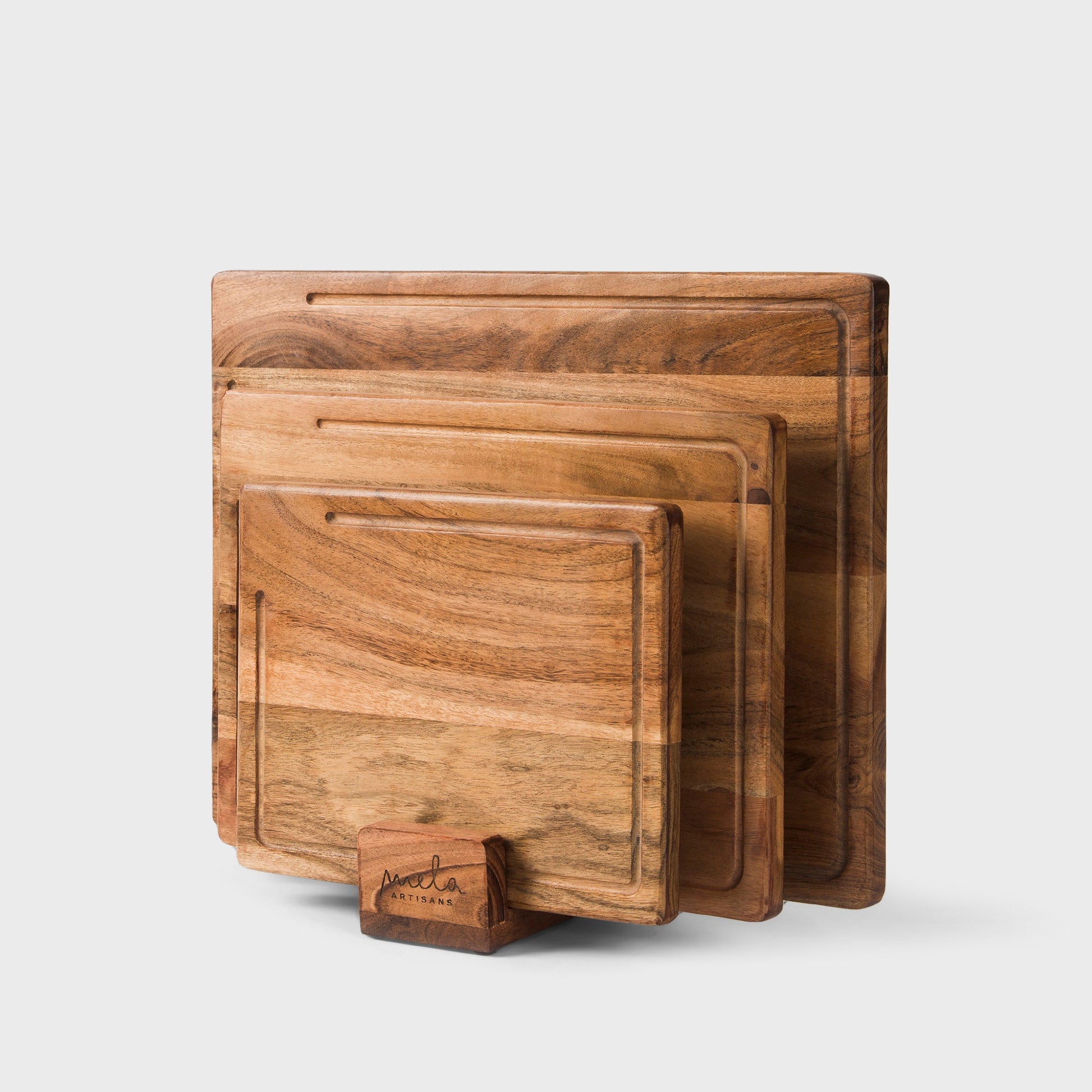 three piece acacia wood cutting board set with stand by mela artisans
