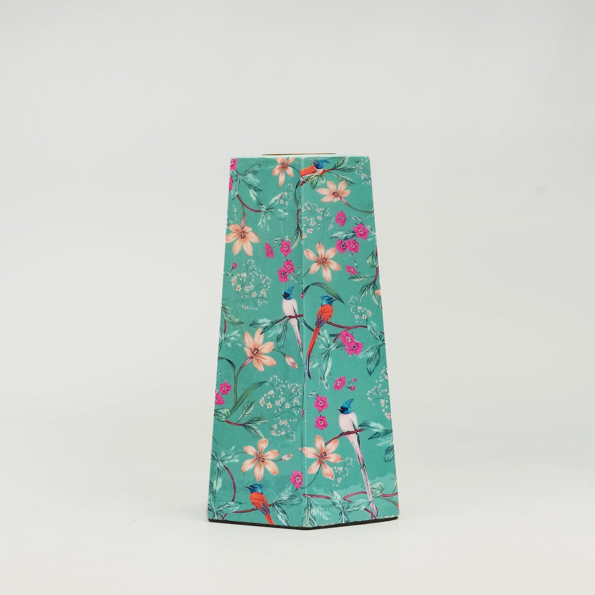 Handcrafted floral enamel candleholders adding a vibrant pop of color to a modern home interior.