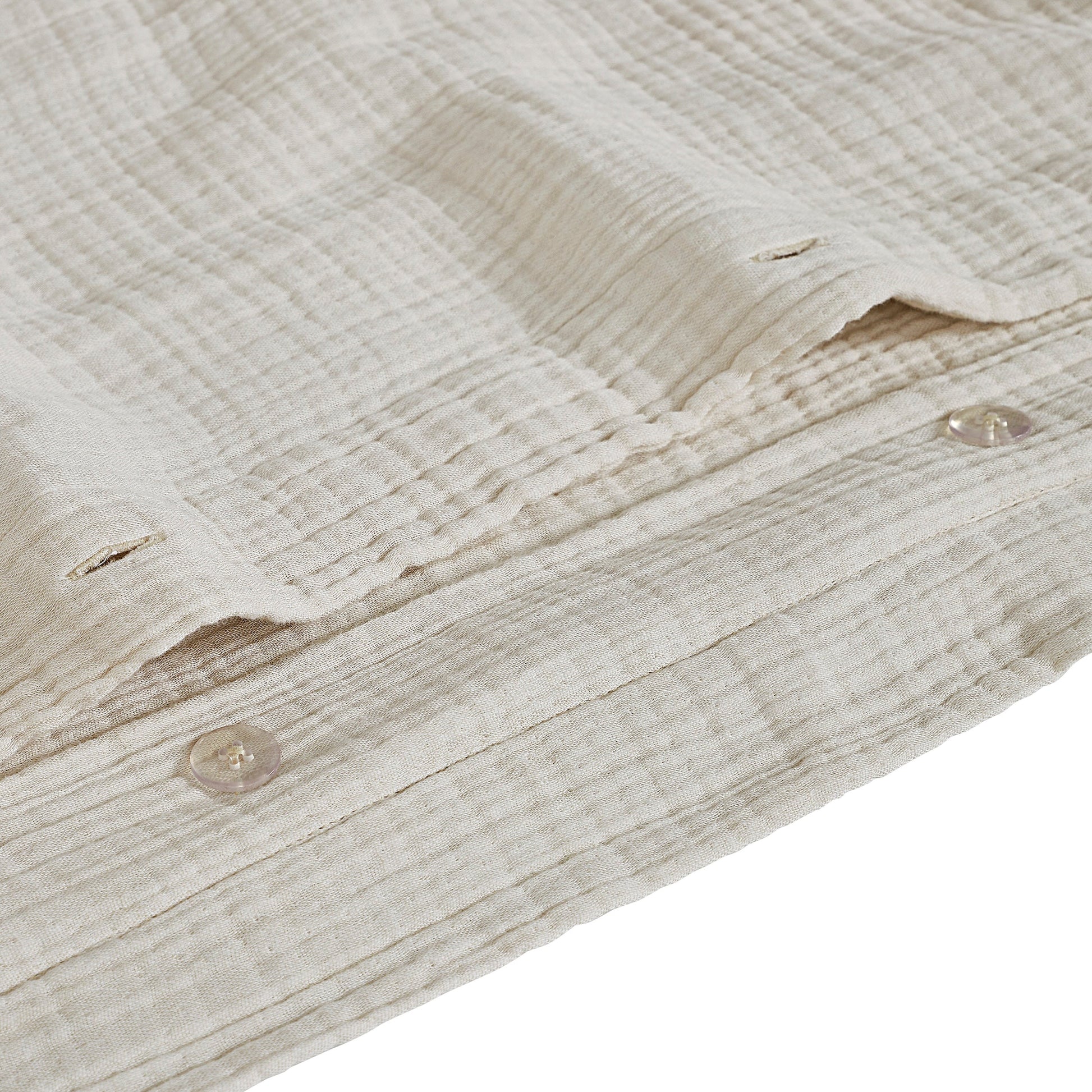 DT-049-9092_8|Detailed view of cream textured duvet cover with durable, stylish button closure, ensuring secure and neat bedding.