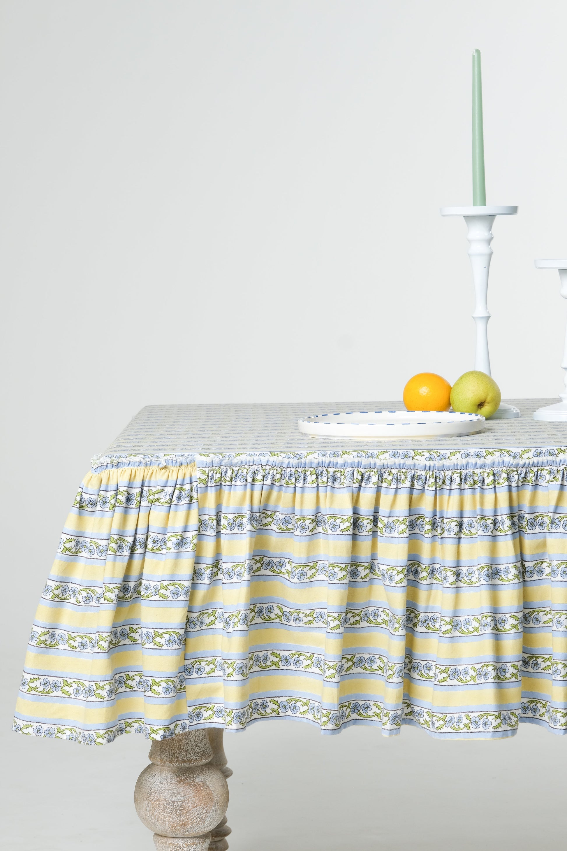 Inner Child Provence ruffled butter yellow blockprint tablecloth on wooden table