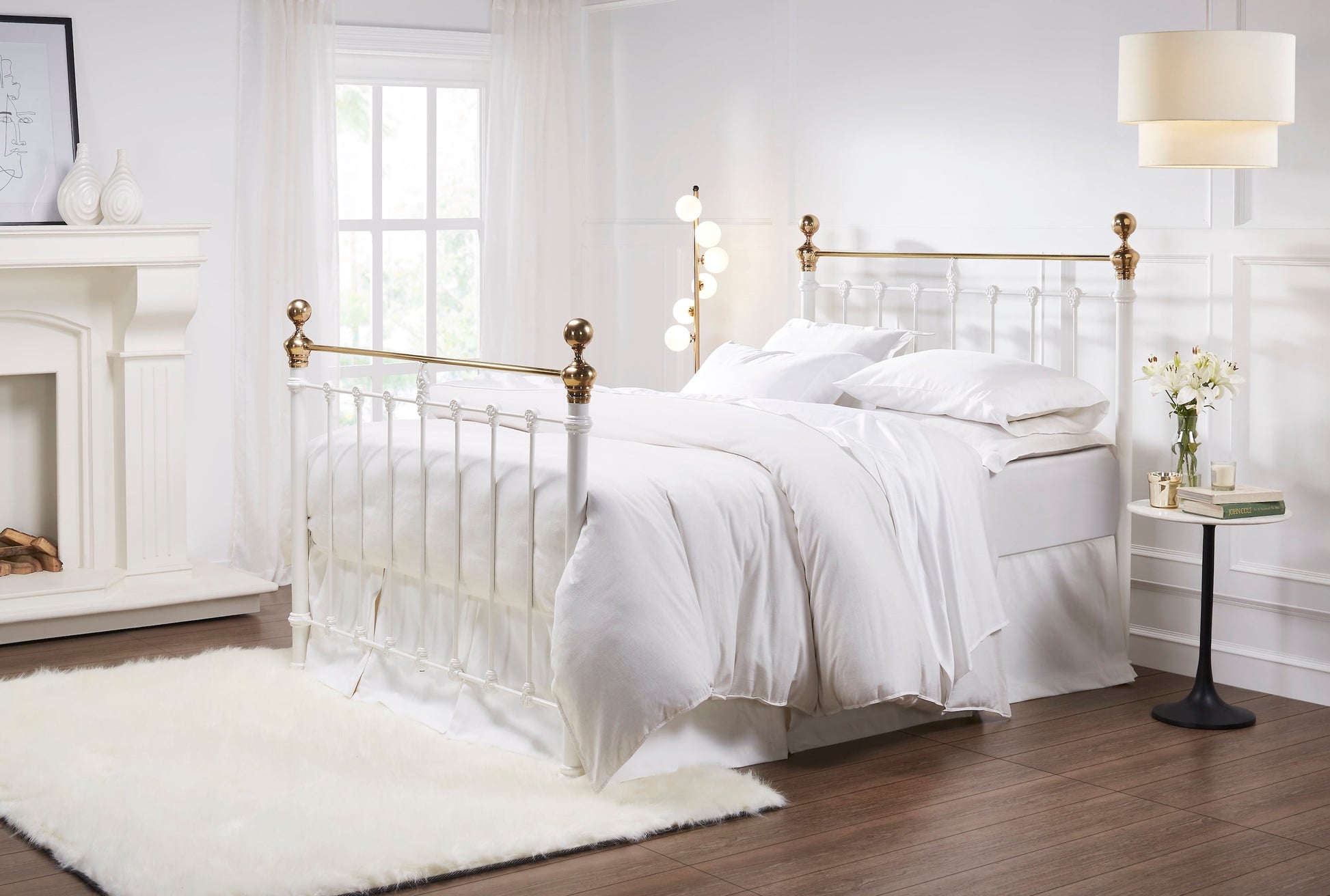 MB-202-7680_2|Classic white metal bed frame with polished brass finials, elegantly dressed with crisp white bedding for a timeless look.