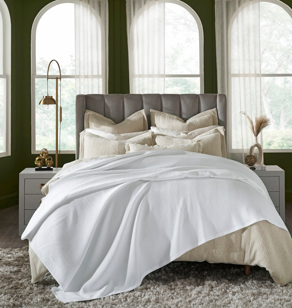 BL-858-X_1|White ribbed blanket elegantly draped over a luxurious bed in a stylish bedroom, offering ultimate comfort and style.