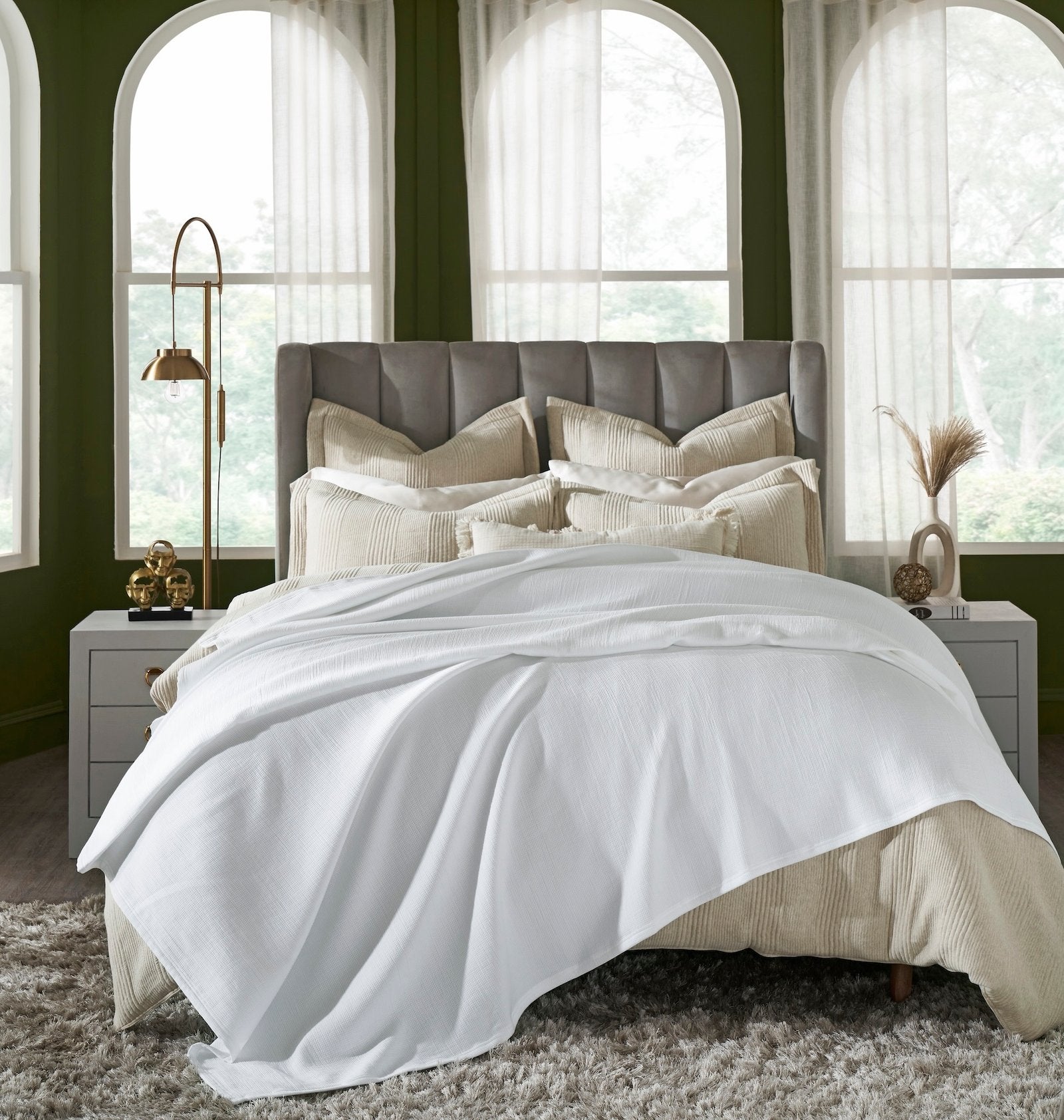 BL-858-X_1|White ribbed blanket elegantly draped over a luxurious bed in a stylish bedroom, offering ultimate comfort and style.