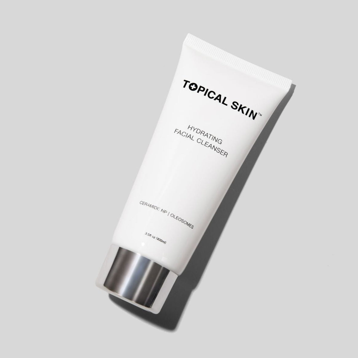 Hydrating Facial Cleanser with Oleosomes TOPICAL SKIN Hydrating facial cleanser in white tube, ceramide oleosomes.