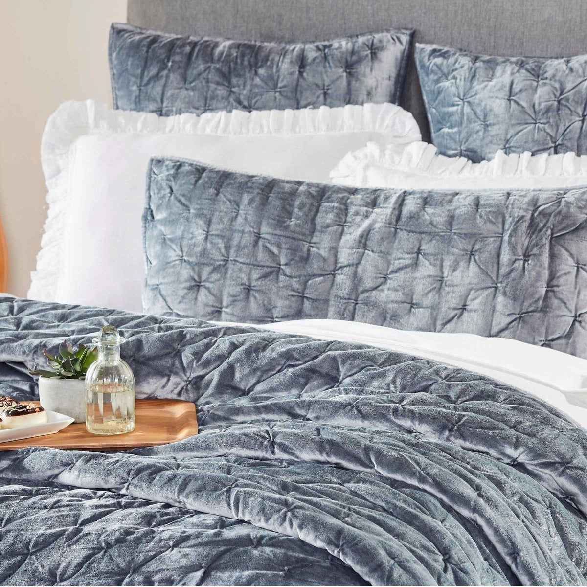 QT-336-9496_5|Plush blue velvet quilt featuring a modern pinched quilting design, adding luxurious texture and cozy warmth to your bed.