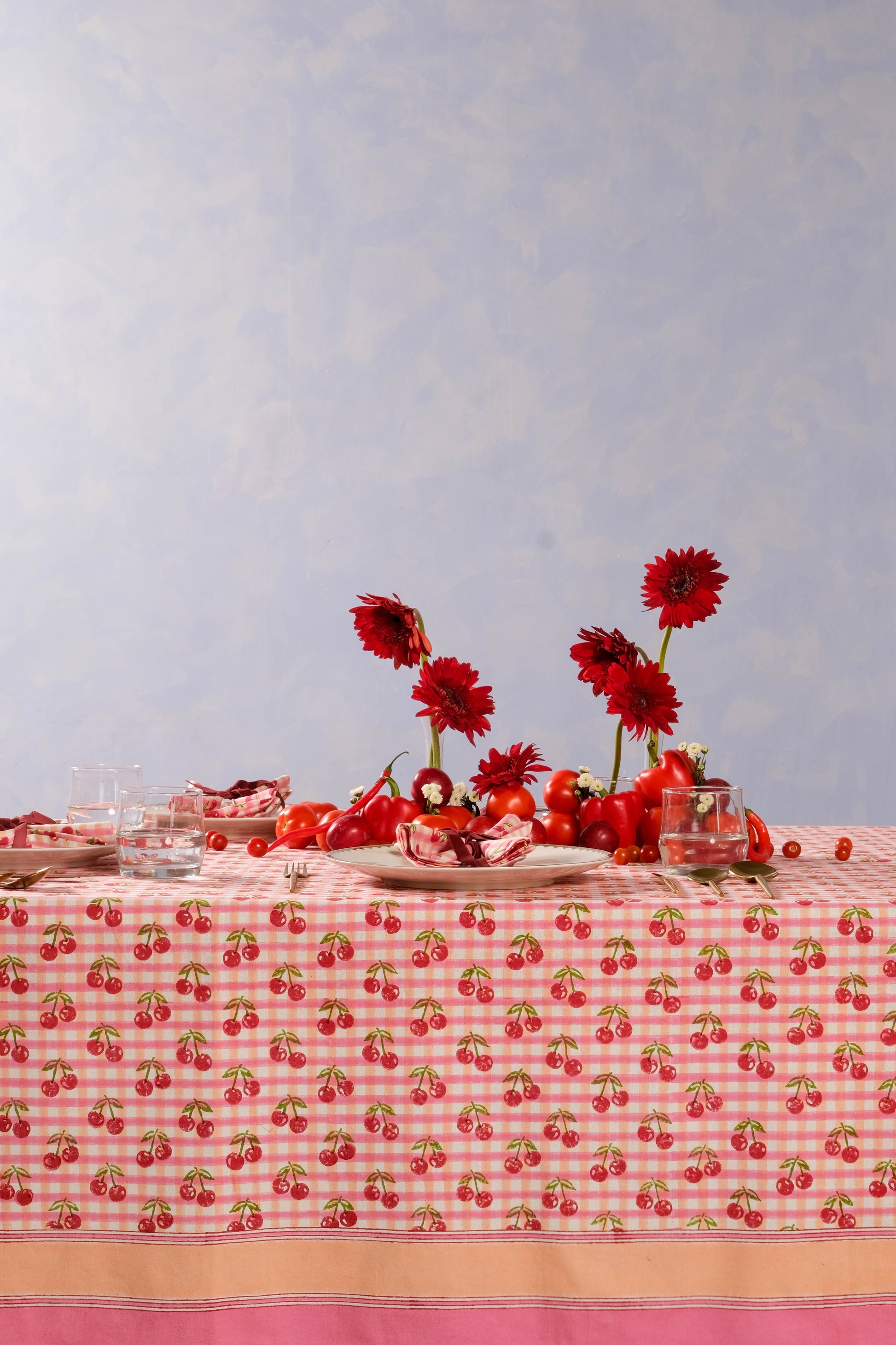 Inner Child cherry blockprint red gingham tablecloth with fresh produce centerpiece