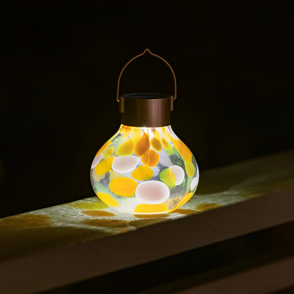 Tea Lantern Handlown Solar Glass on table