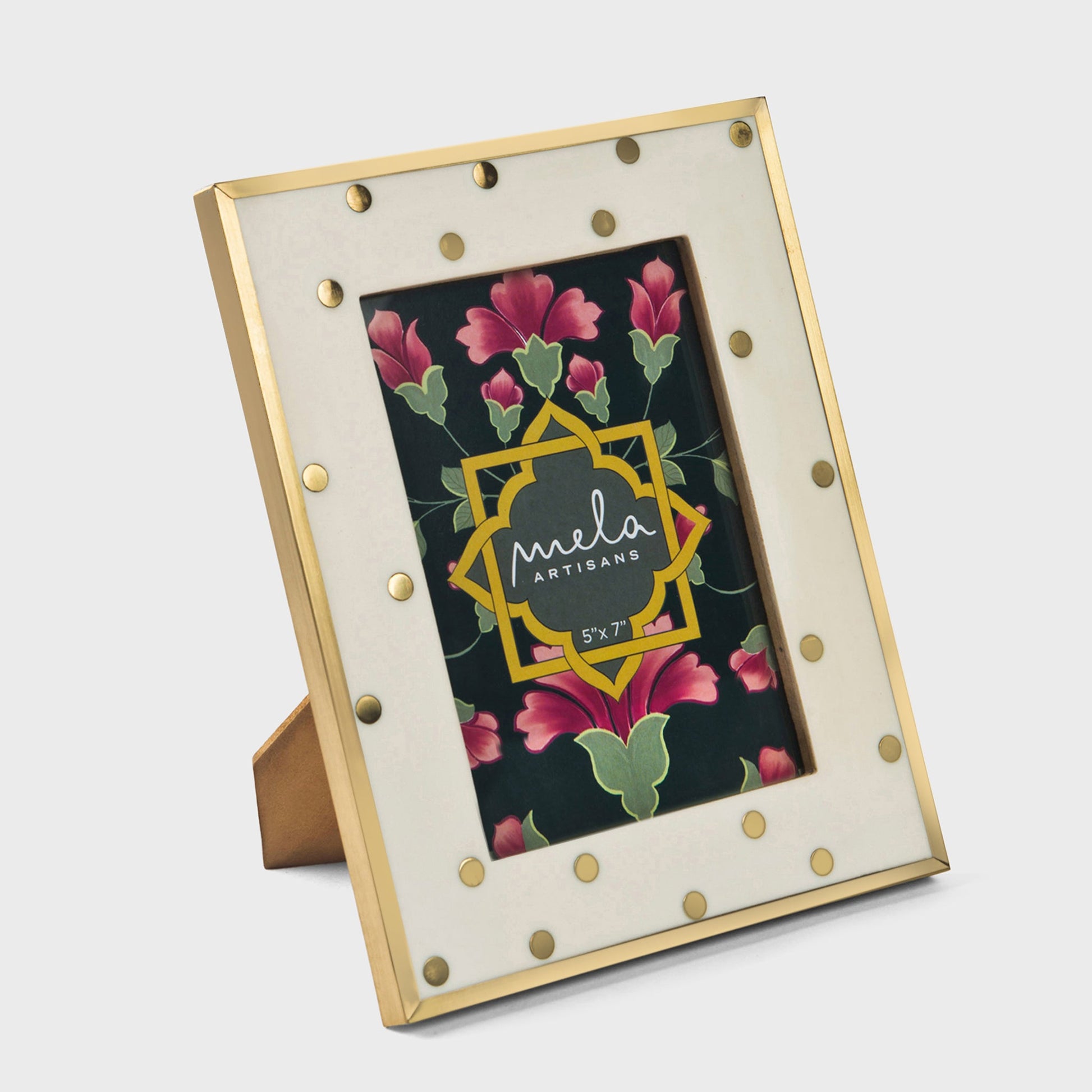 Close-up of brass inlay on ivory resin surface