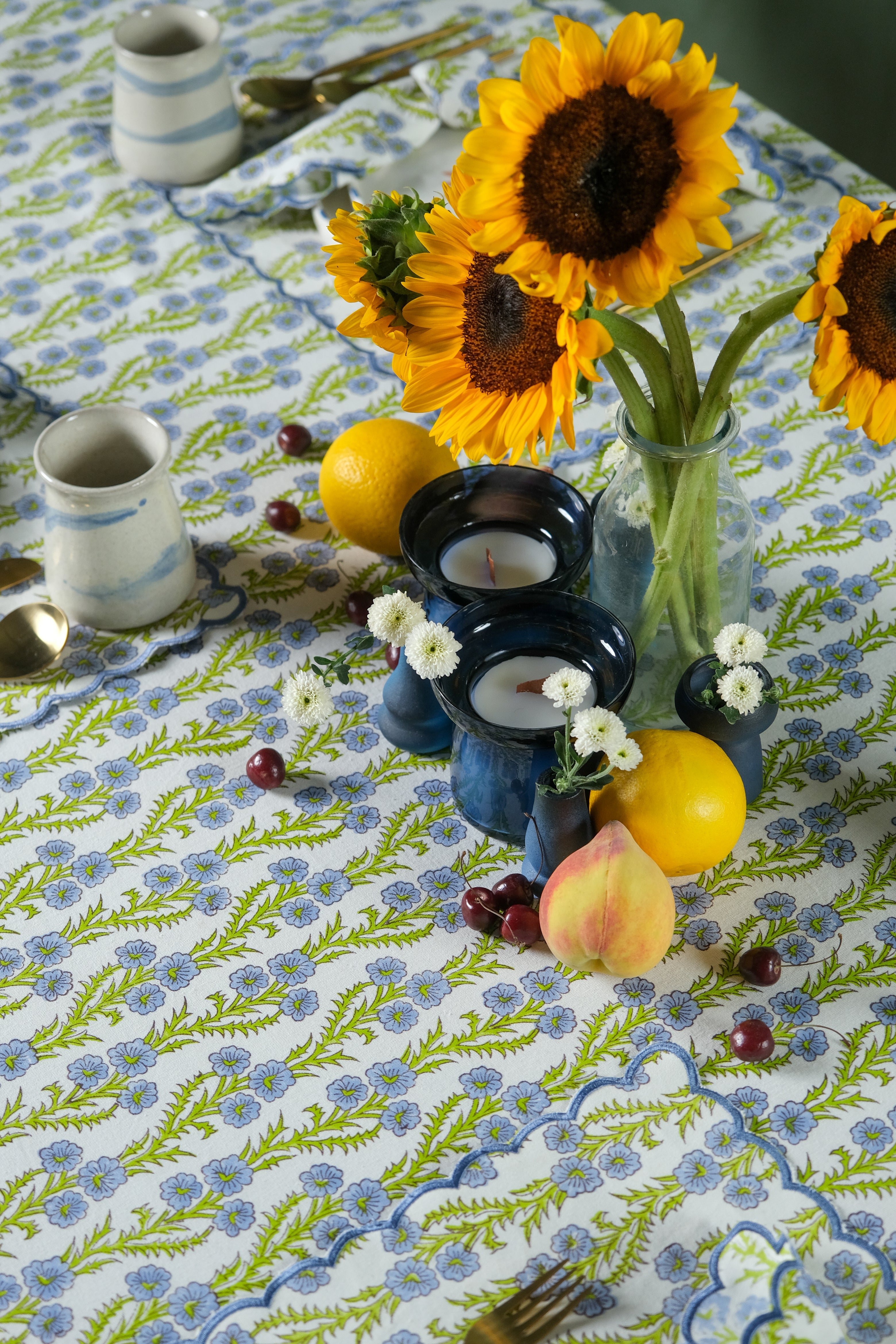 Forget-Me-Not scallop embroidered blockprint tablecloth with sunflower centerpiece